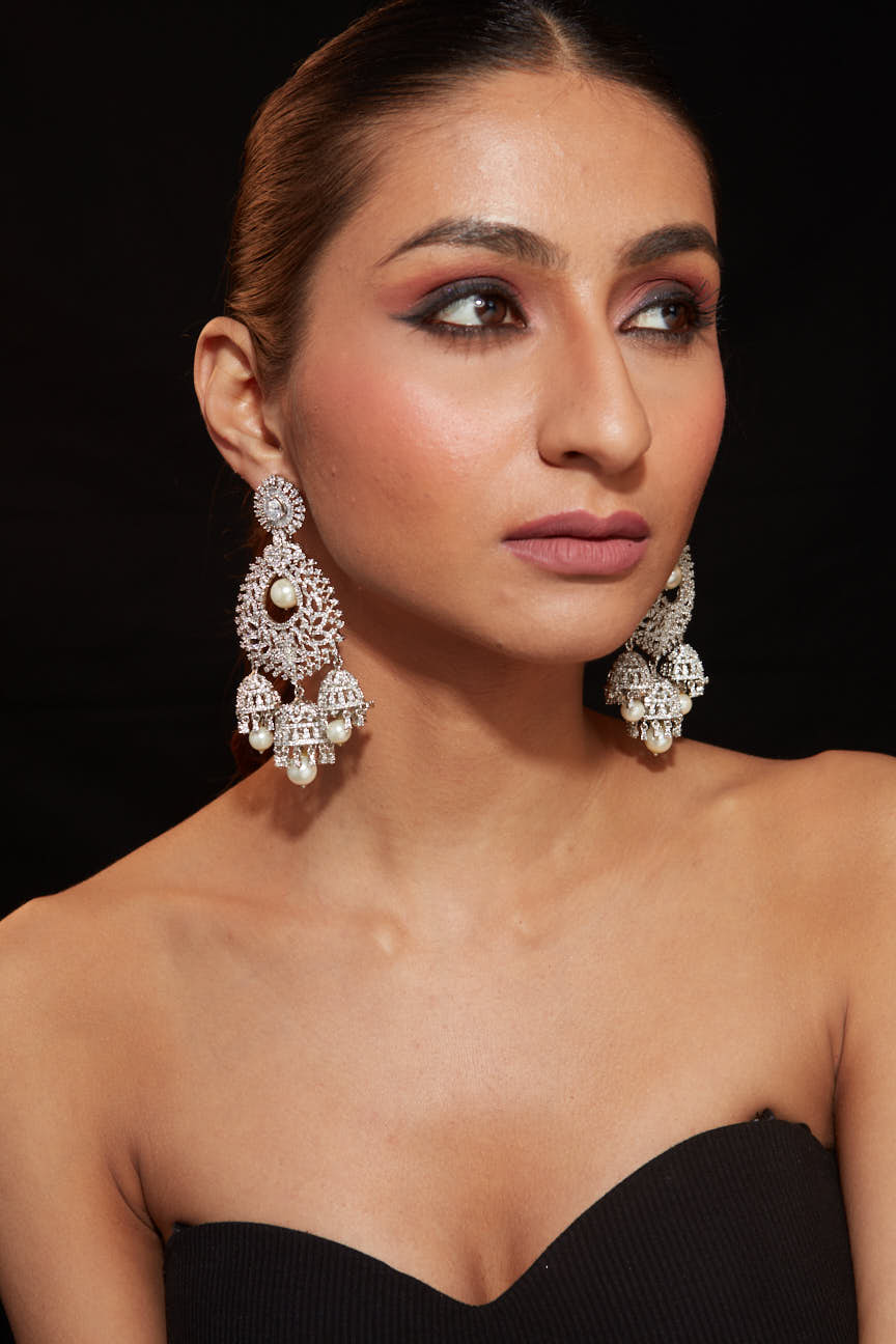 Image of Rhodium Plated Zircon Studded With Pearl Drop Jhumka Dangle Earrings