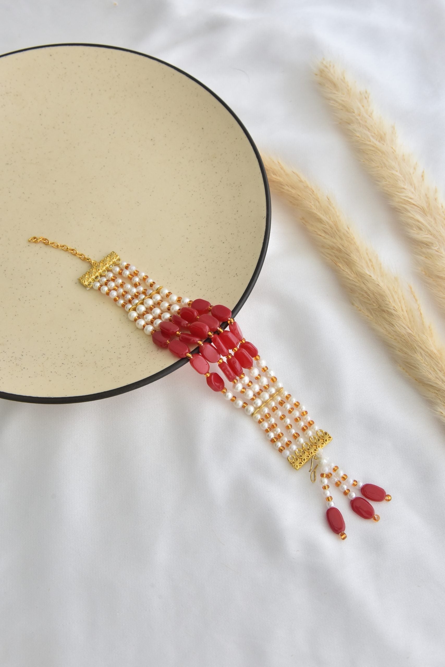 Red and White Gold Tone Pearl Bracelet