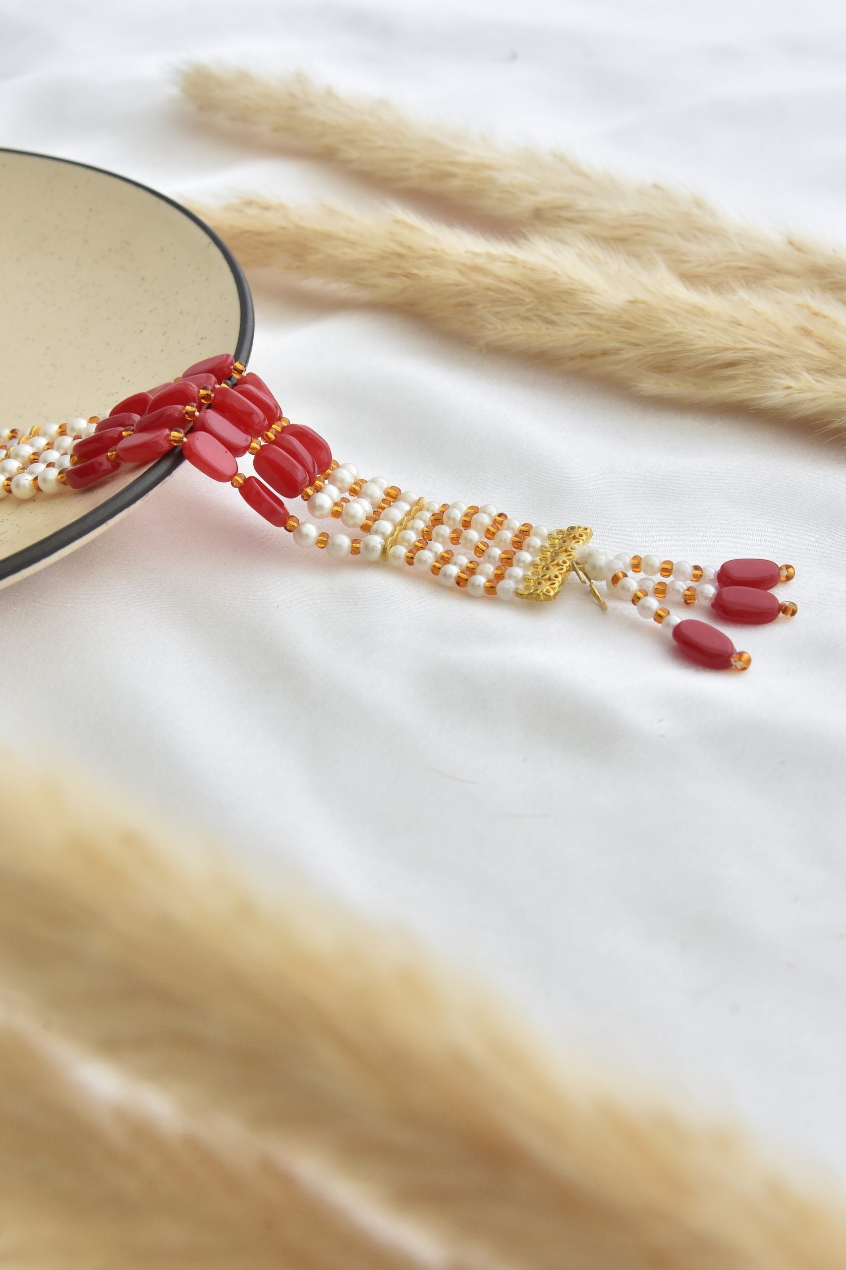 Red and White Gold Tone Pearl Bracelet