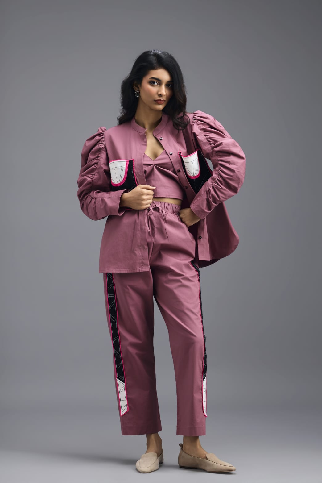 PINK TAILORED PANTS WITH NEON GEOMETRIC POCKET PANEL DETAIL