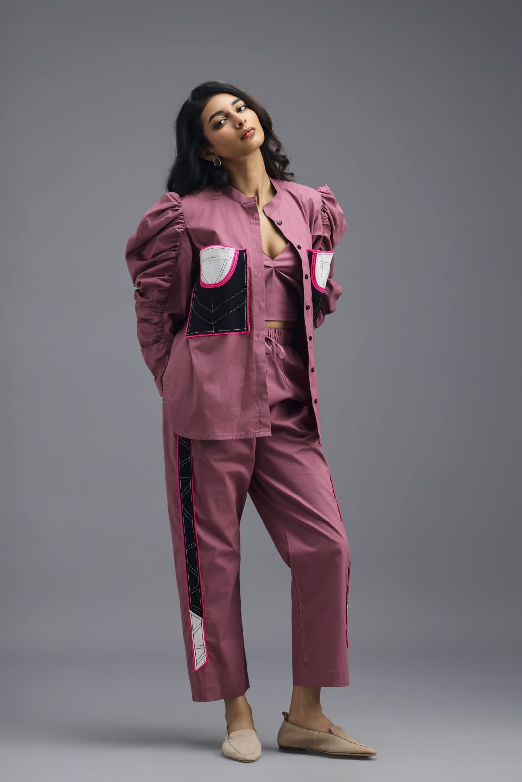 PINK TAILORED PANTS WITH NEON GEOMETRIC POCKET PANEL DETAIL