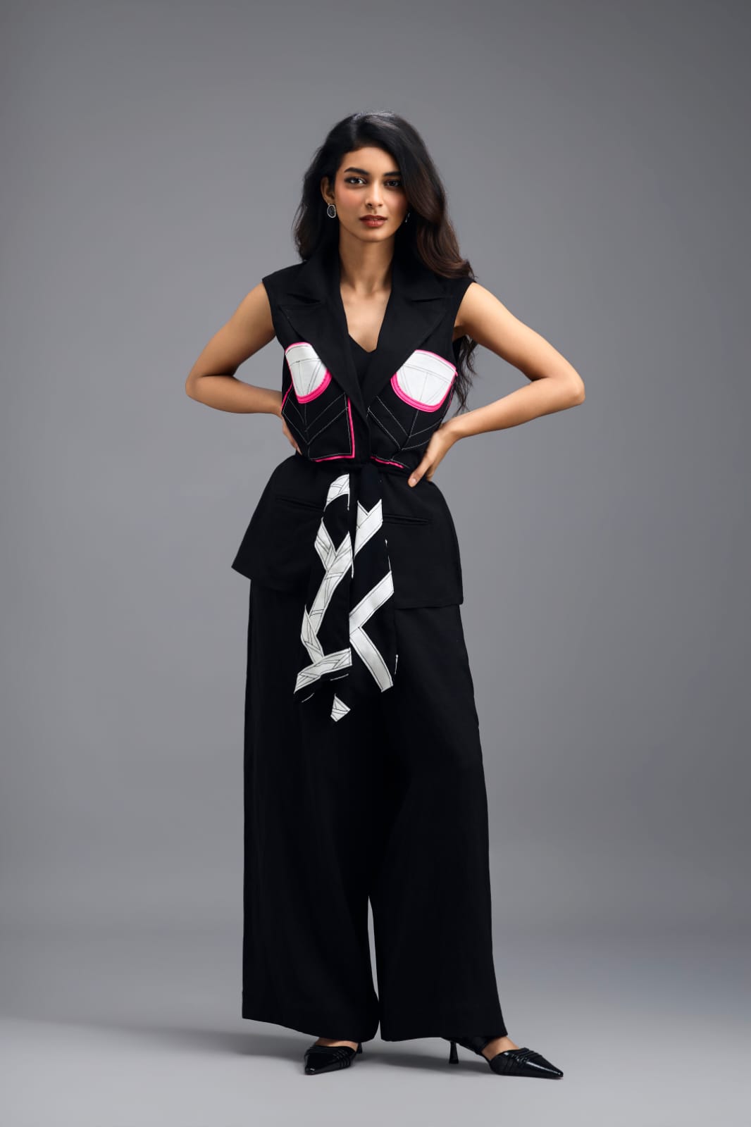 BLACK CO-ORD SET WITH NEON GEOMETRIC PANELLED SLEEVELESS BLAZER, TWISTED TOP AND TROUSERS