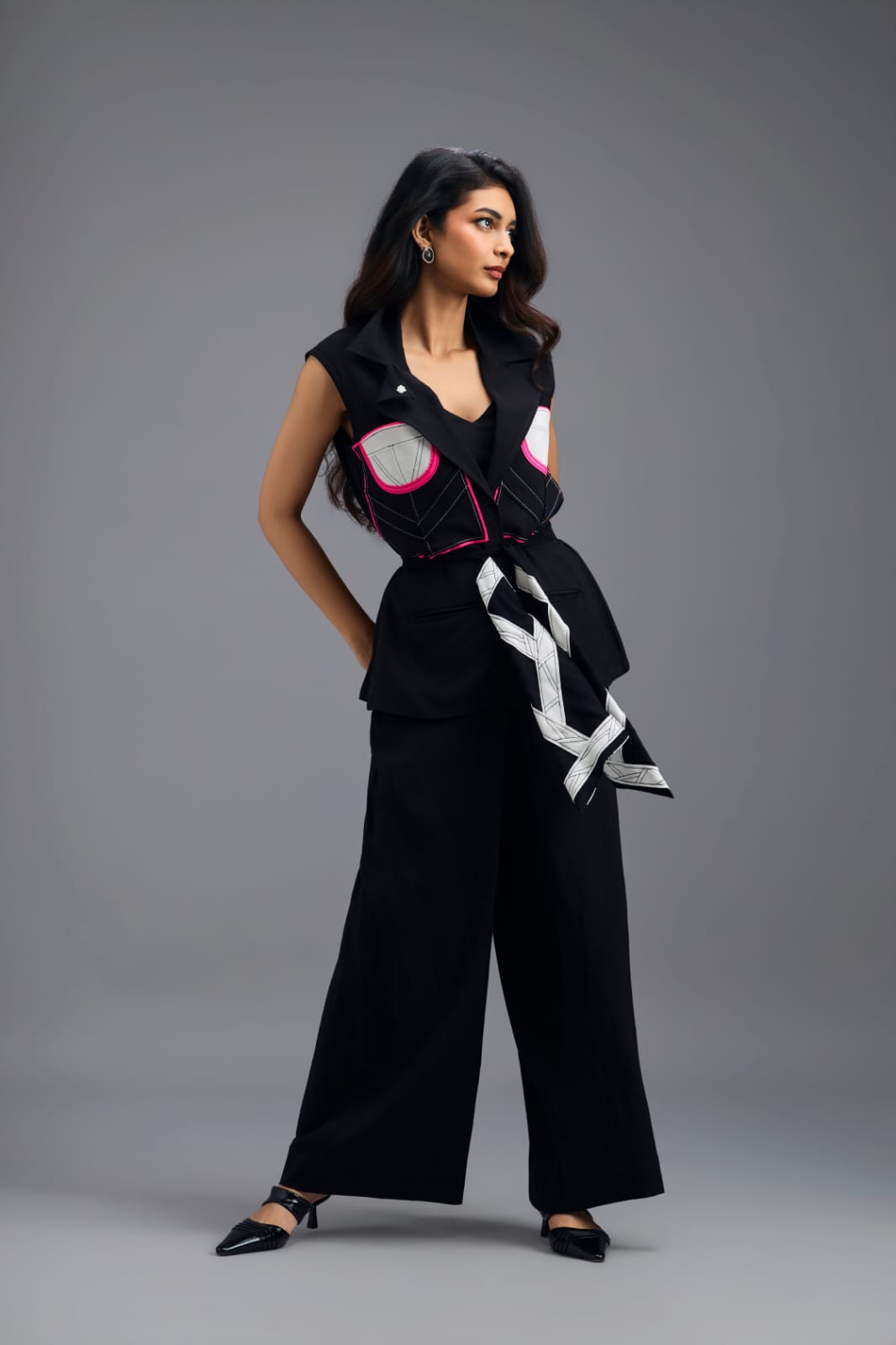 BLACK CO-ORD SET WITH NEON GEOMETRIC PANELLED SLEEVELESS BLAZER, TWISTED TOP AND TROUSERS