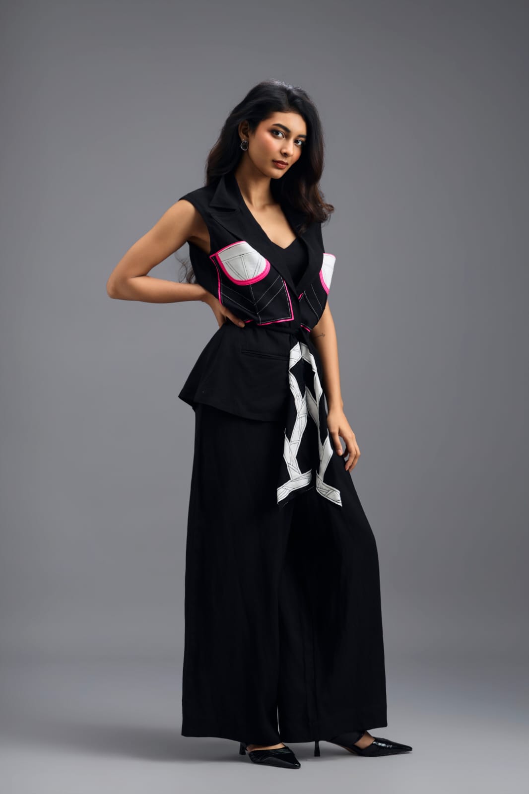 BLACK CO-ORD SET WITH NEON GEOMETRIC PANELLED SLEEVELESS BLAZER, TWISTED TOP AND TROUSERS