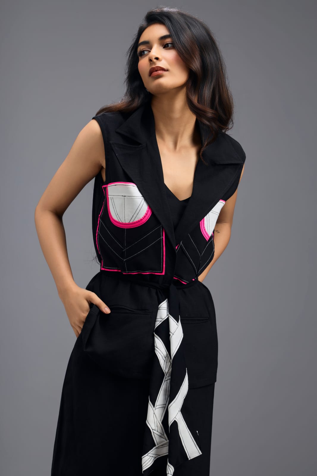 BLACK CO-ORD SET WITH NEON GEOMETRIC PANELLED SLEEVELESS BLAZER, TWISTED TOP AND TROUSERS