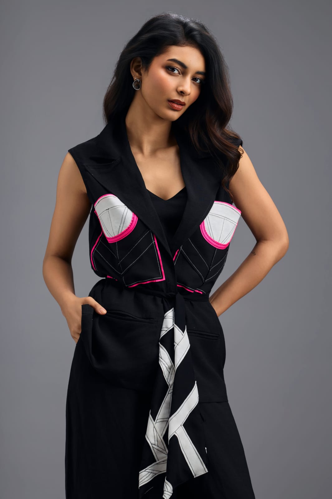 BLACK CO-ORD SET WITH NEON GEOMETRIC PANELLED SLEEVELESS BLAZER, TWISTED TOP AND TROUSERS