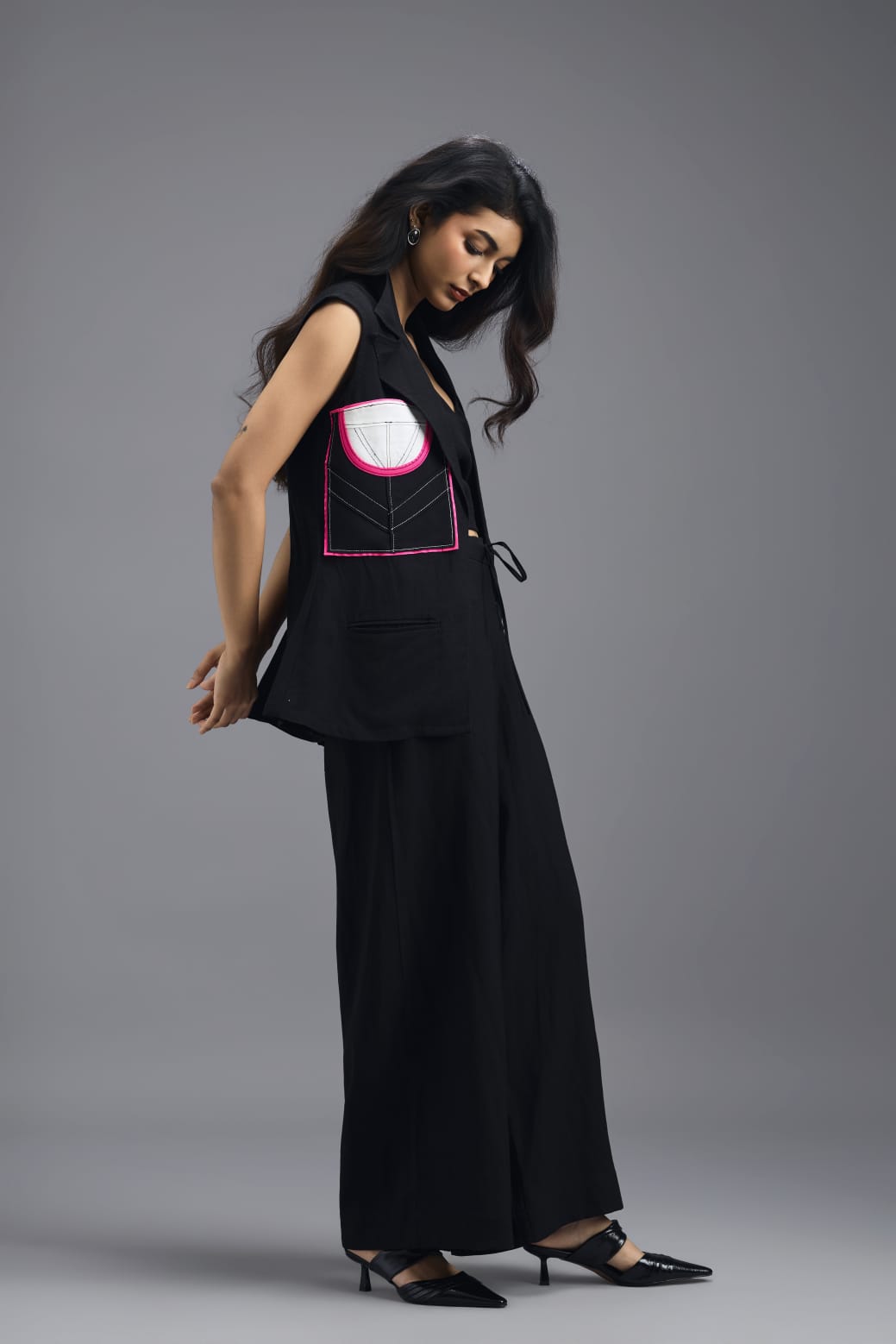 BLACK CO-ORD SET WITH NEON GEOMETRIC PANELLED SLEEVELESS BLAZER, TWISTED TOP AND TROUSERS