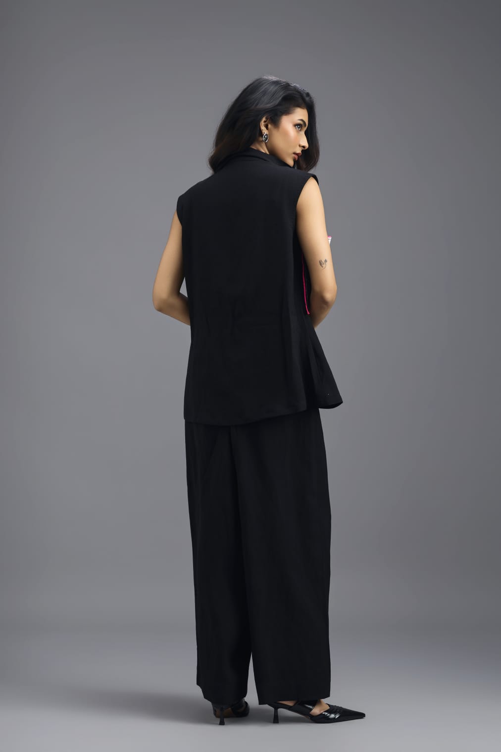 BLACK CO-ORD SET WITH NEON GEOMETRIC PANELLED SLEEVELESS BLAZER, TWISTED TOP AND TROUSERS