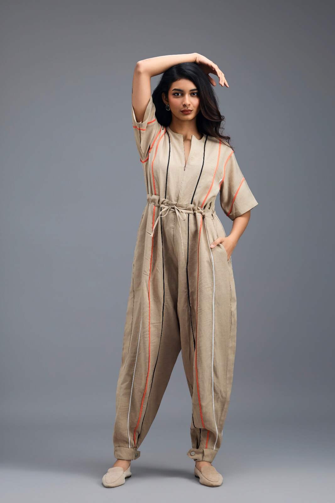 BEIGE ZIP-FRONT JUMPSUIT WITH NEON CONTRAST PIPING