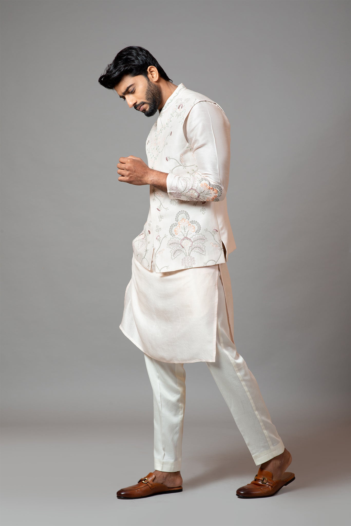 Baby pink Nehru jacket with Multi colour garden themed embroidery paired with tonal kurta and pant pajama Set